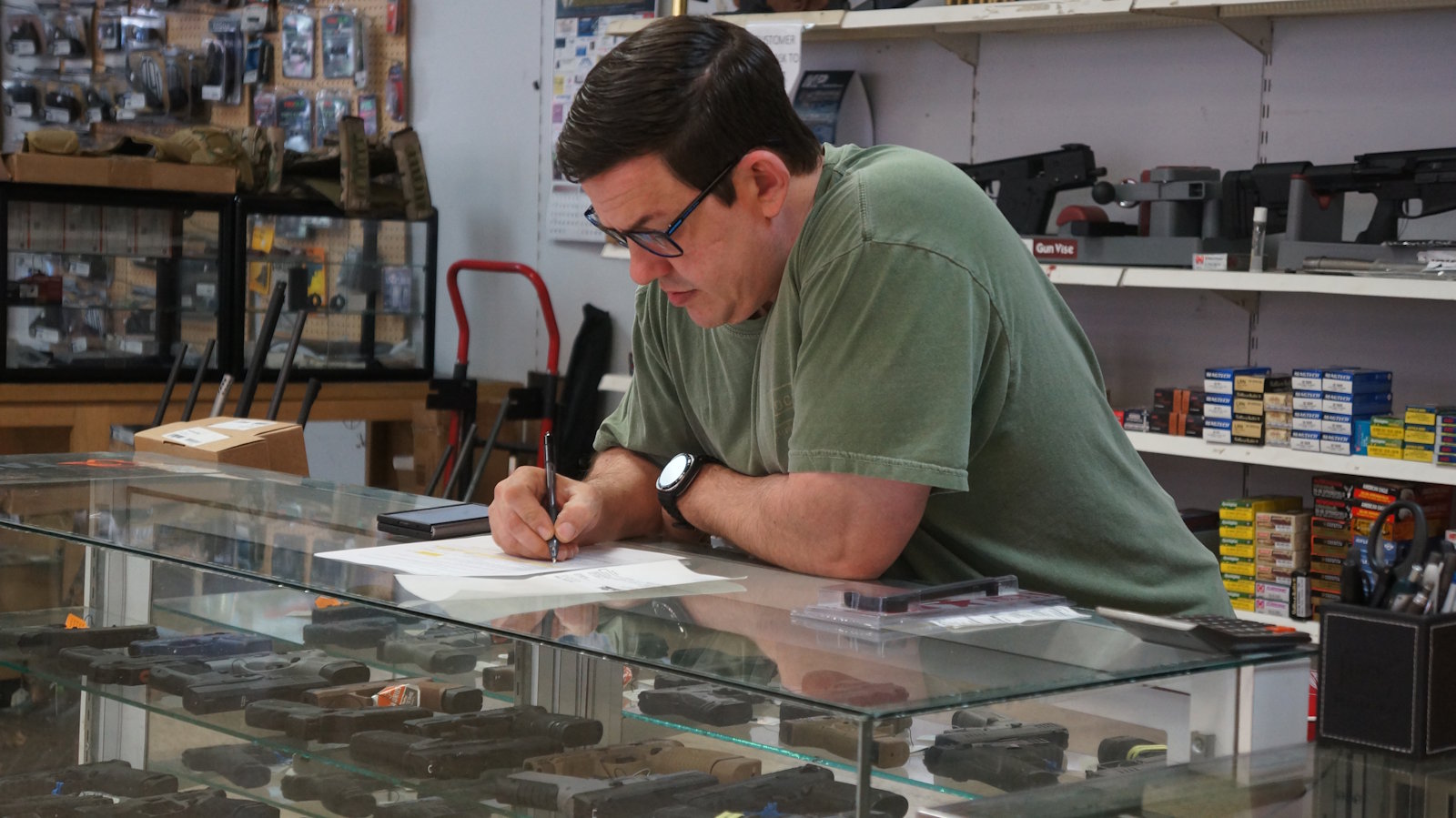 Drew completing FFL paperwork at Foothills Firearm Factory in Marion NC