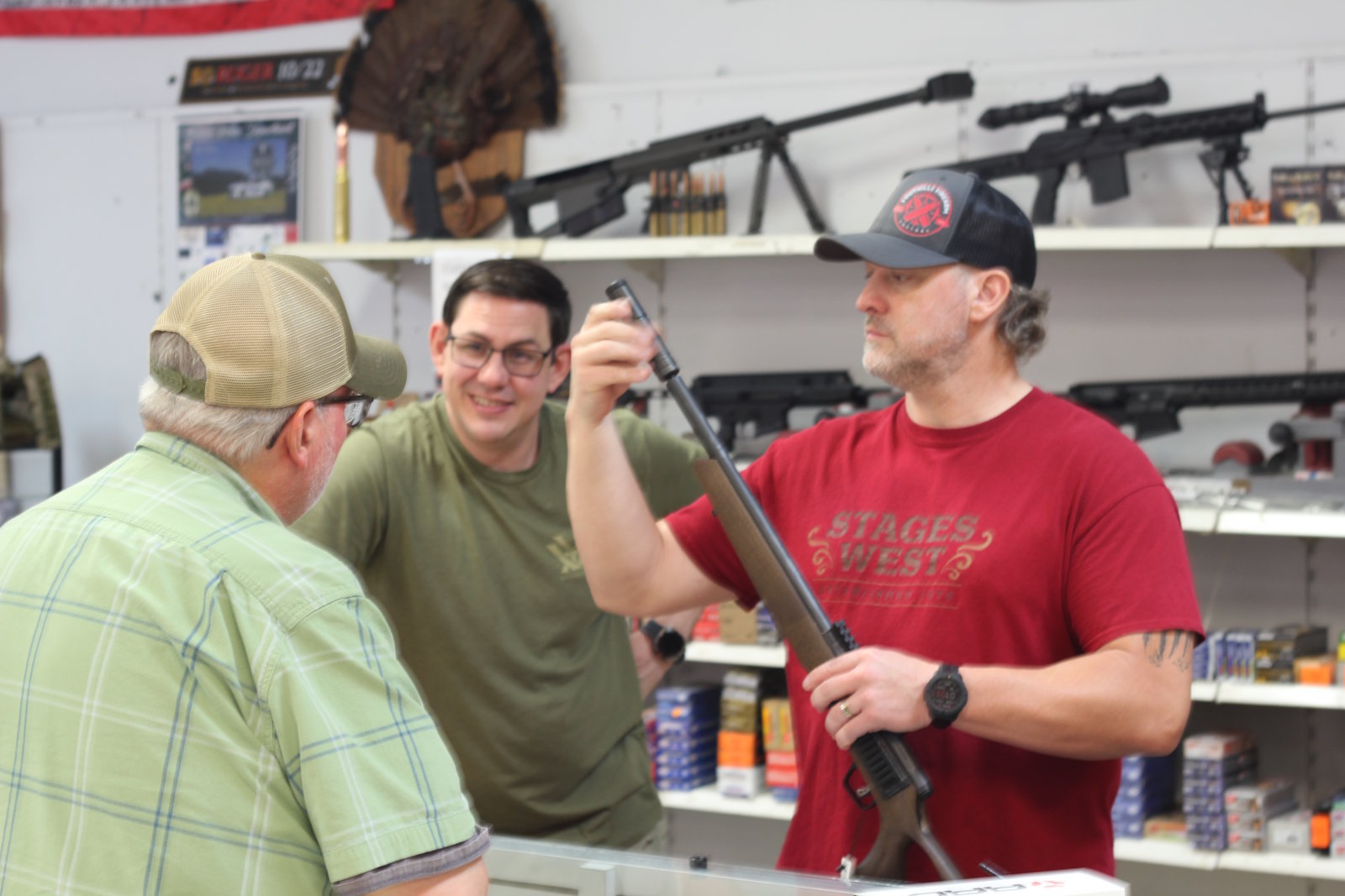 Drew helping a customer choose a firearm at Foothills Firearm Factory in Marion NC