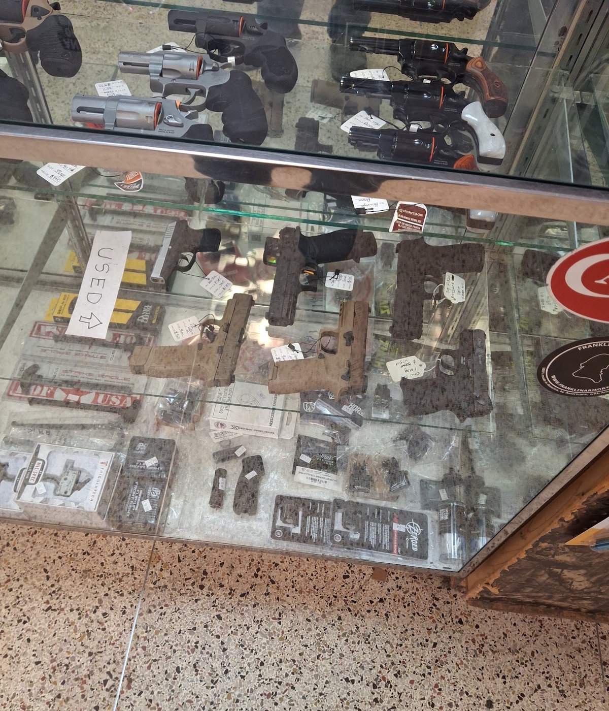 Used handguns displayed for sale at Foothills Firearm Factory in Marion North Carolina